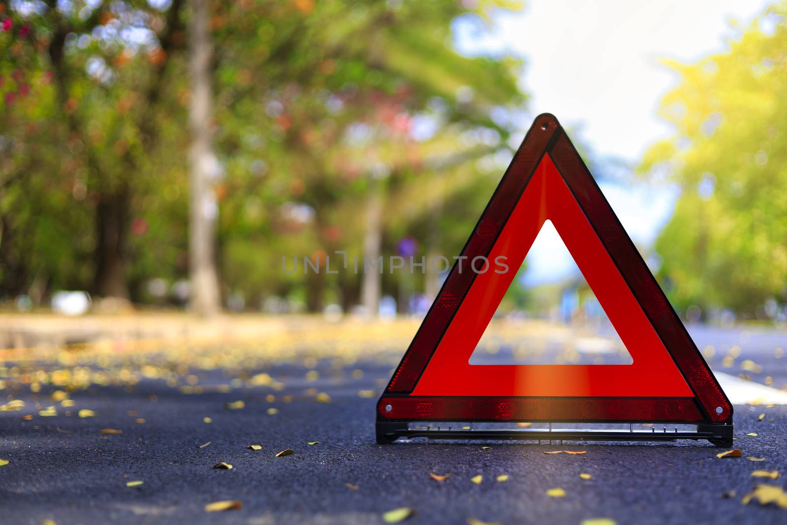 Red triangle, red emergency stop sign, red emergency symbol on road. With copy space for text or design