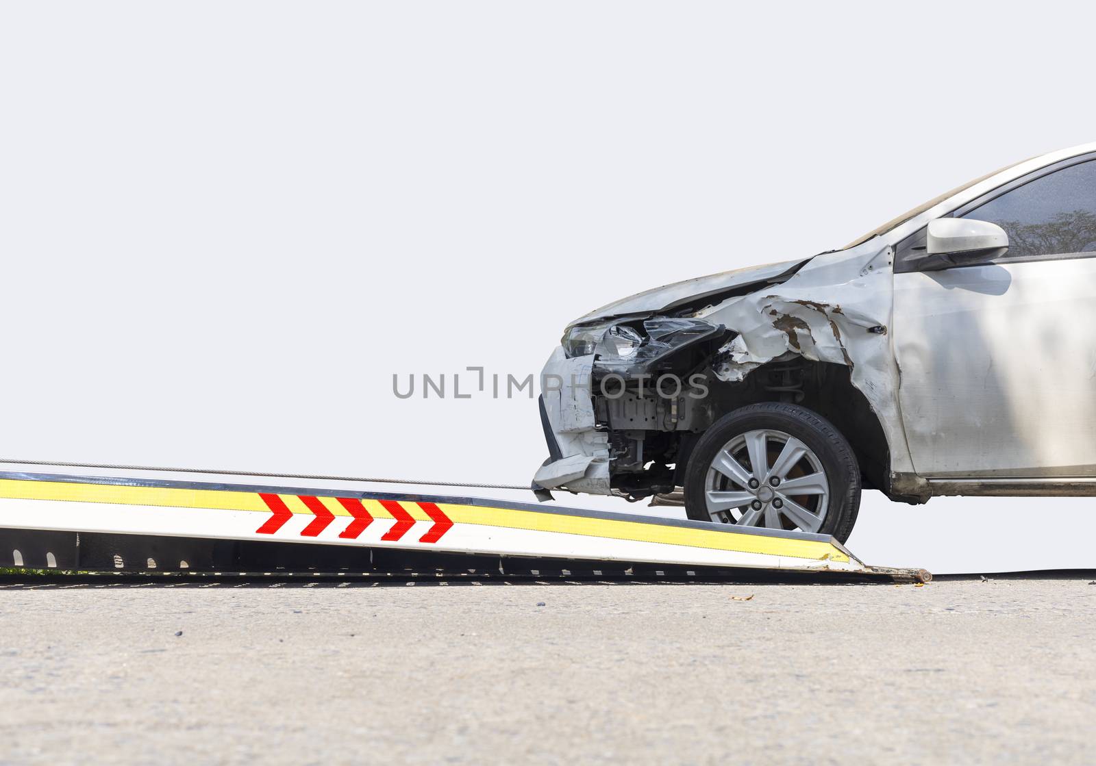accident Car Slide on  truck for move. Gray car have damage by accident on road take with slide truck move . Isolate on white background.