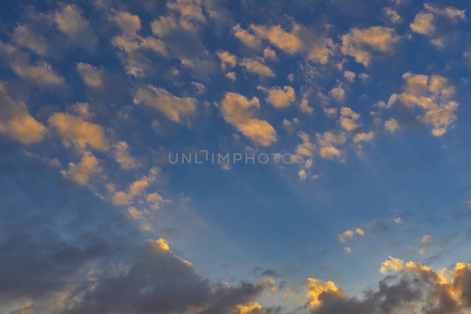 Sky with cloud and sun ray yellow and blue color background. With copy space for text or design.