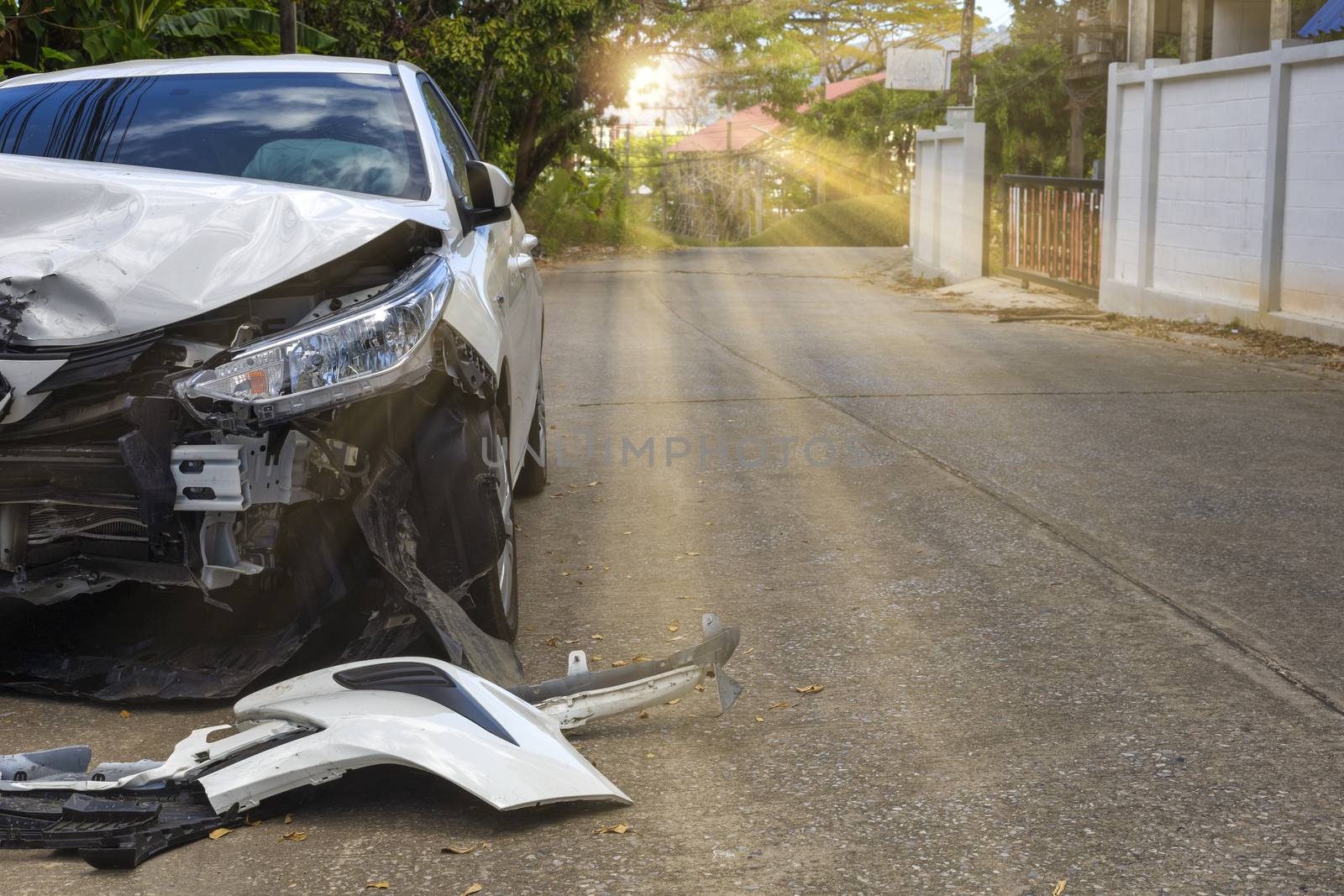 Front of light gray color car with pick up have big damaged and broken by accident on road in morning time can not drive any more park for wait insurance officer. With copy space for text or design