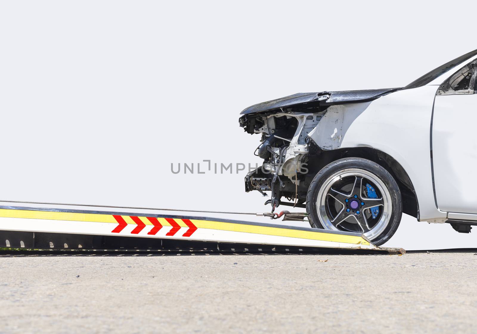 accident Car Slide on  truck for move. Gray car have damage by accident on road take with slide truck move . Isolate on white background.