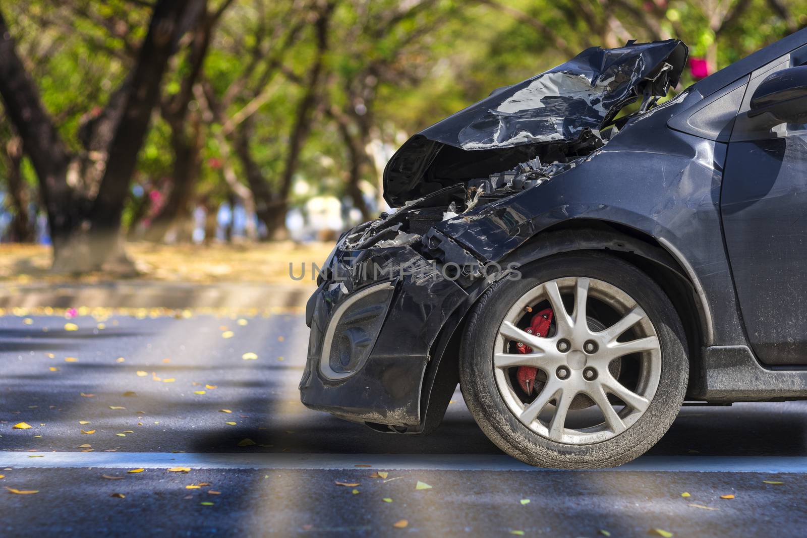 Front of black color car big damaged and broken by accident on city street parking can not drive any more. With copy space for text or design