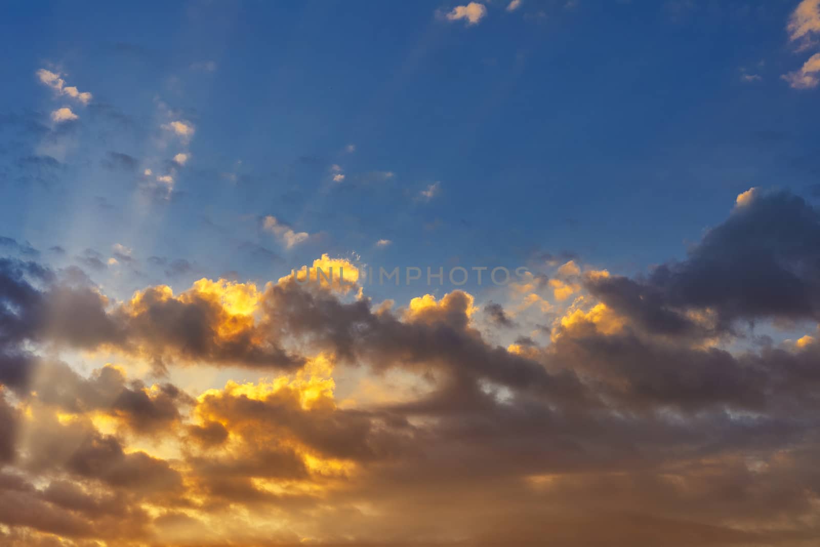 Sky with cloud and sun ray yellow and blue color background. With copy space for text or design.