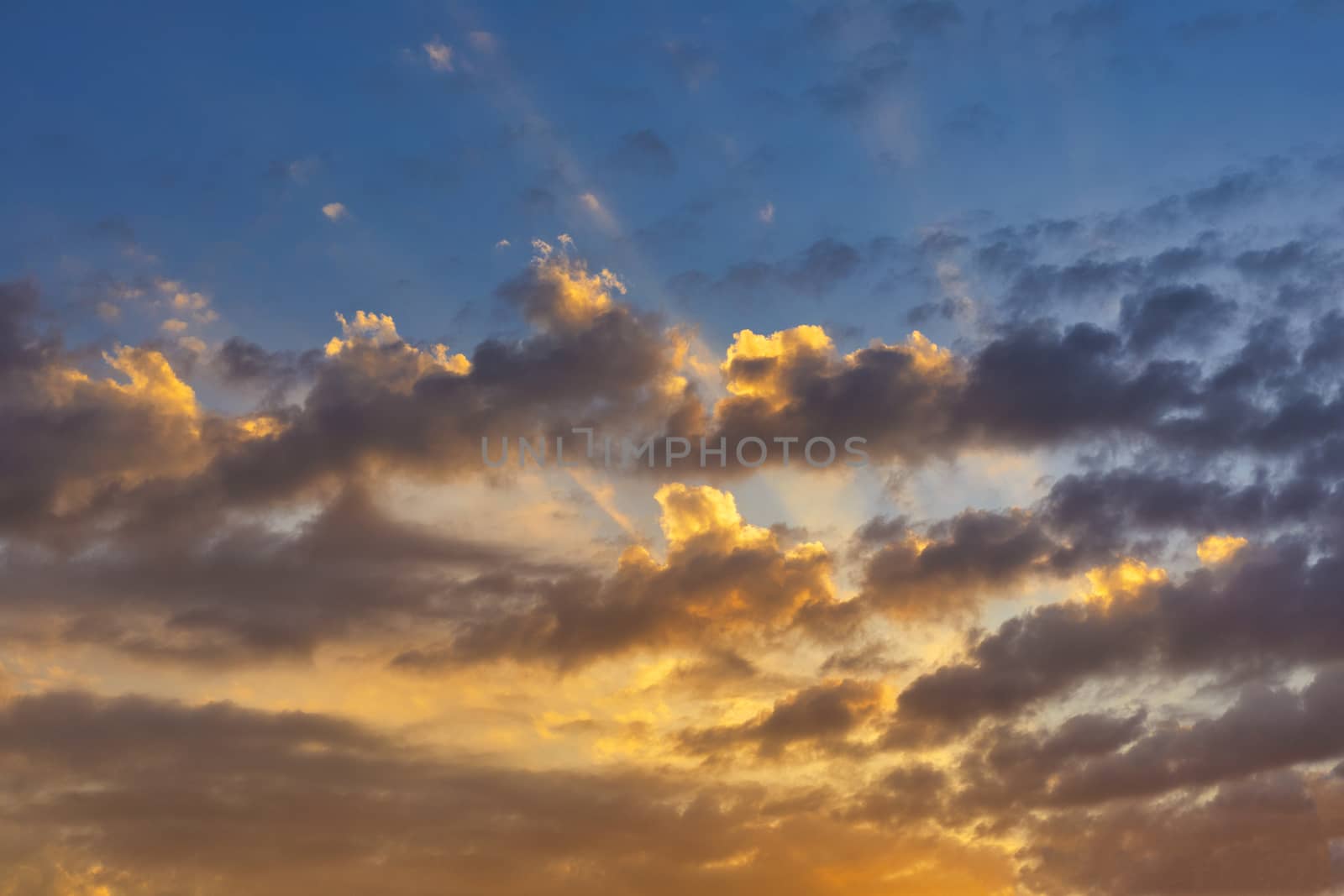 Sky with cloud and sun ray yellow and blue color background. With copy space for text or design.