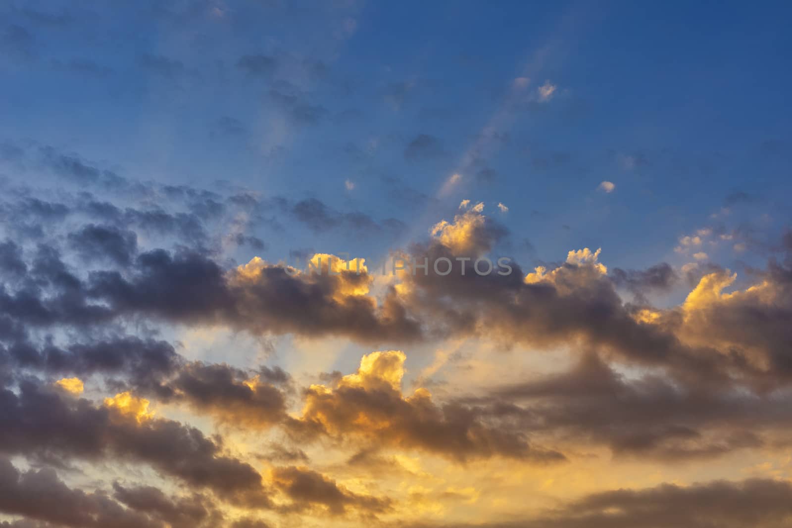 Sky with cloud and sun ray yellow and blue color background. With copy space for text or design.