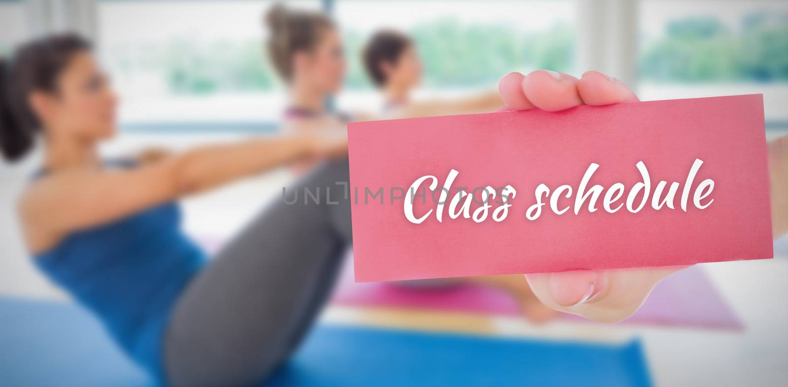 The word class schedule and hand showing card against 