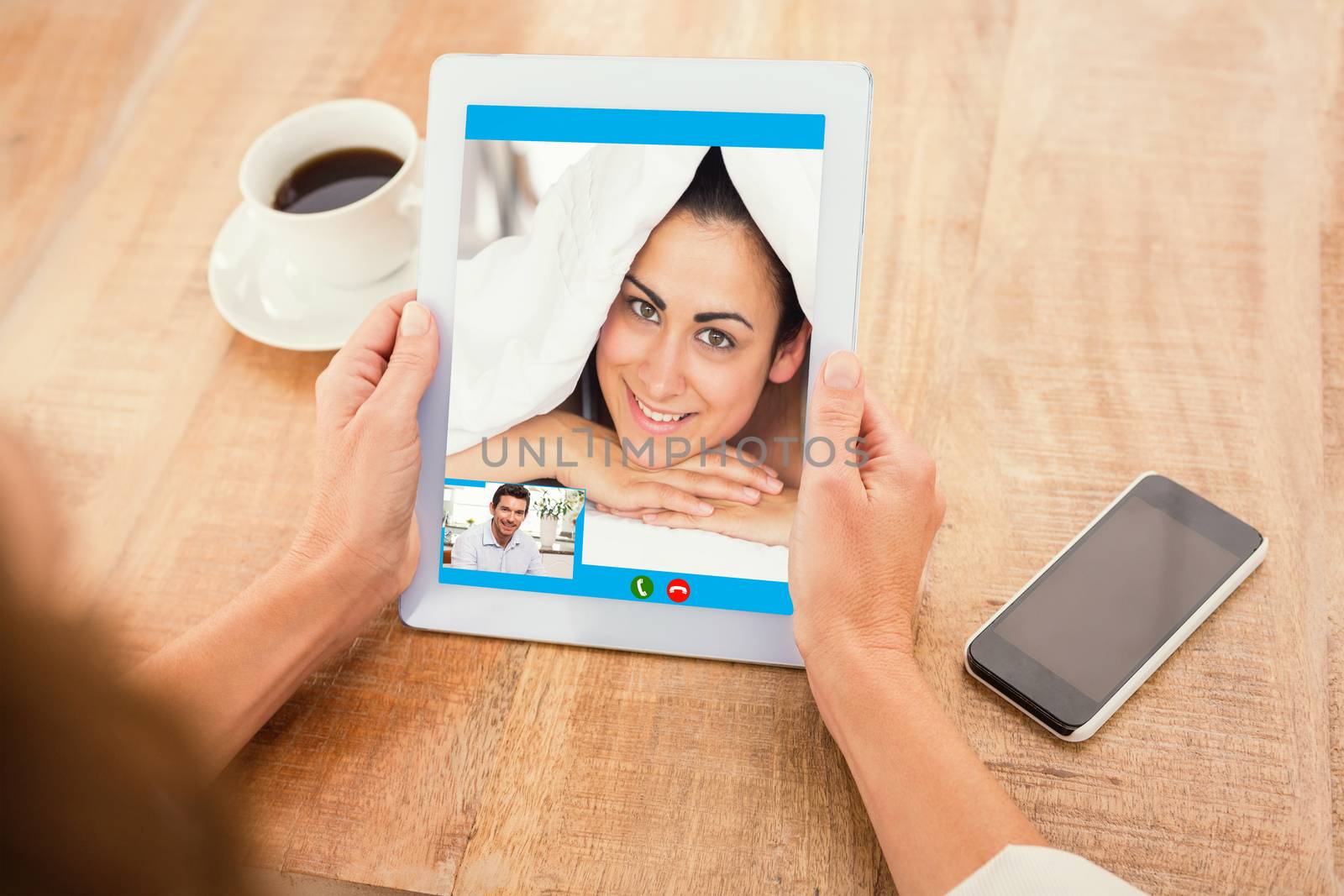 Composite image of smiling man using digital tablet at home by Wavebreakmedia