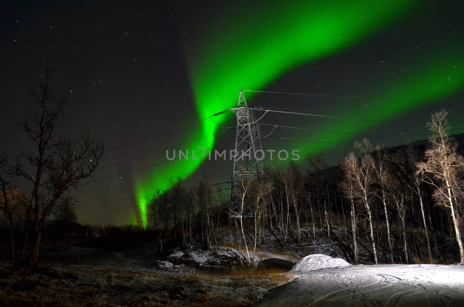 High voltage line with the northern lights