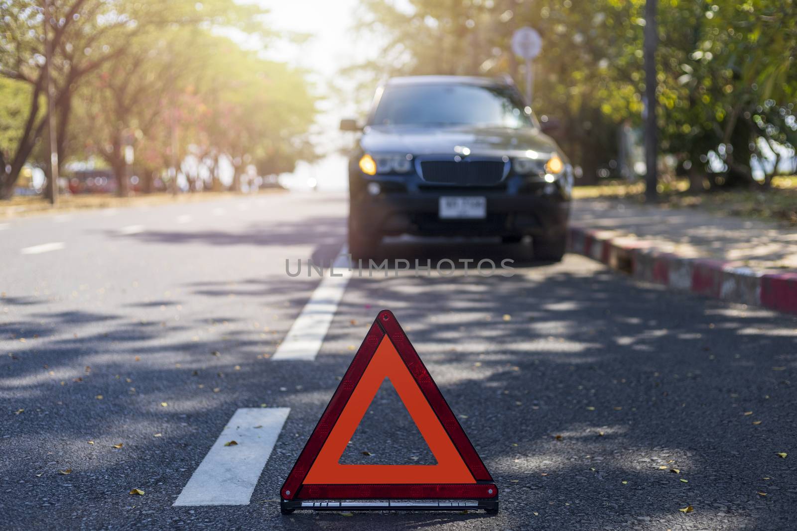Red triangle, red emergency stop sign, red emergency symbol with  car stop and park on road.