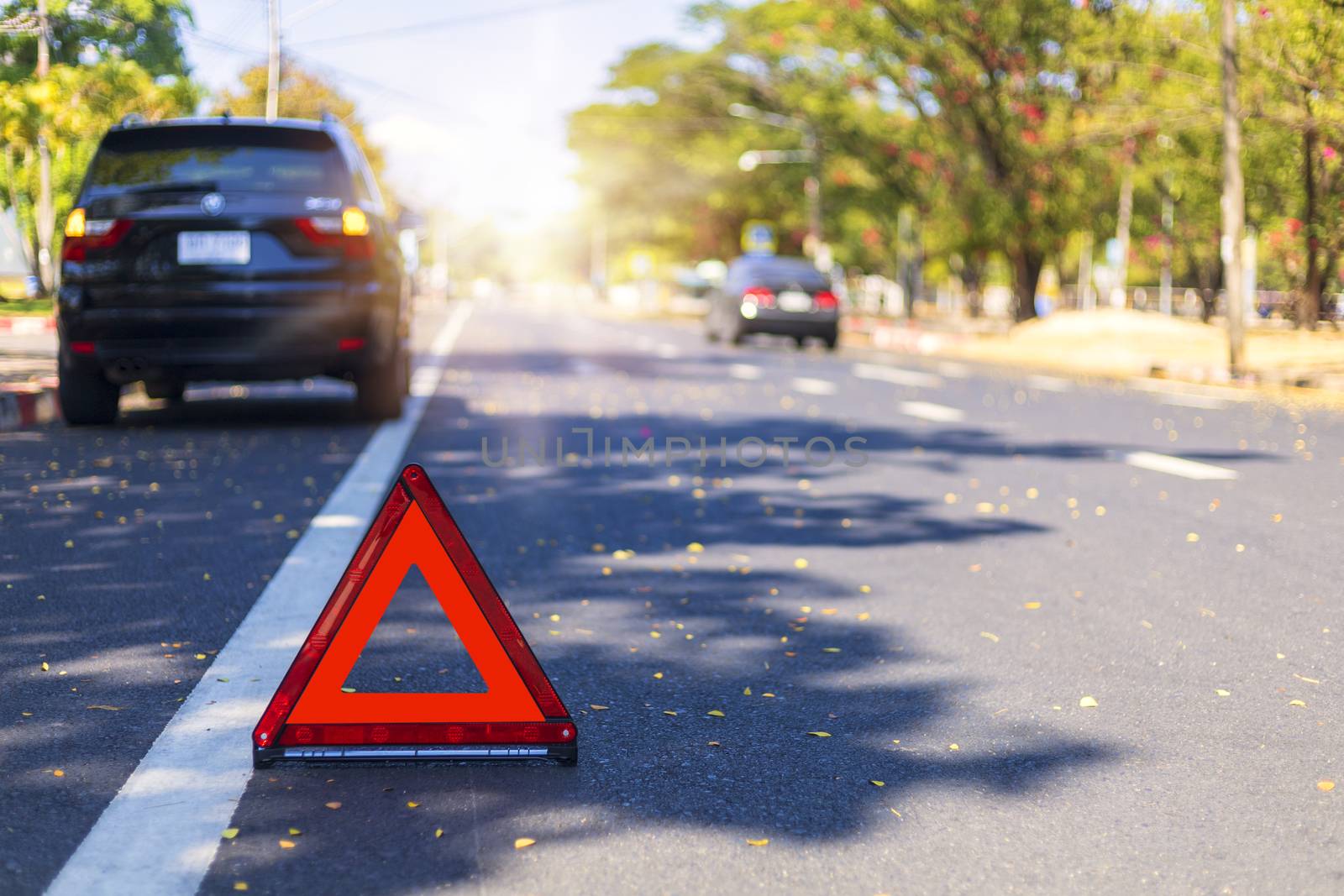 Red triangle, red emergency stop sign, red emergency symbol with  car stop and park on road.