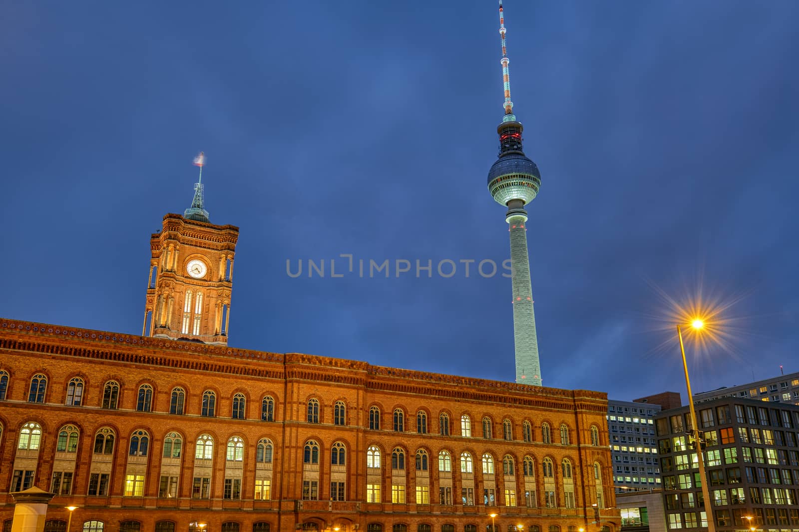 The red city hall and the famous Television Tower in Berlin at night
