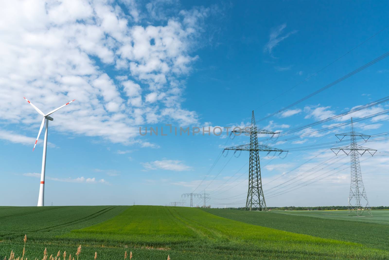Power lines and a wind turbine seen in rural Germany