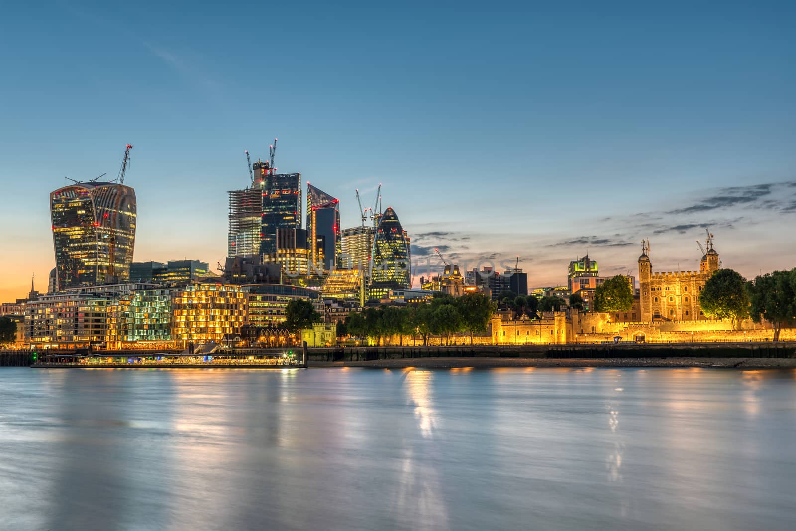 The skyscrapers of the City and the Tower of London after sunset