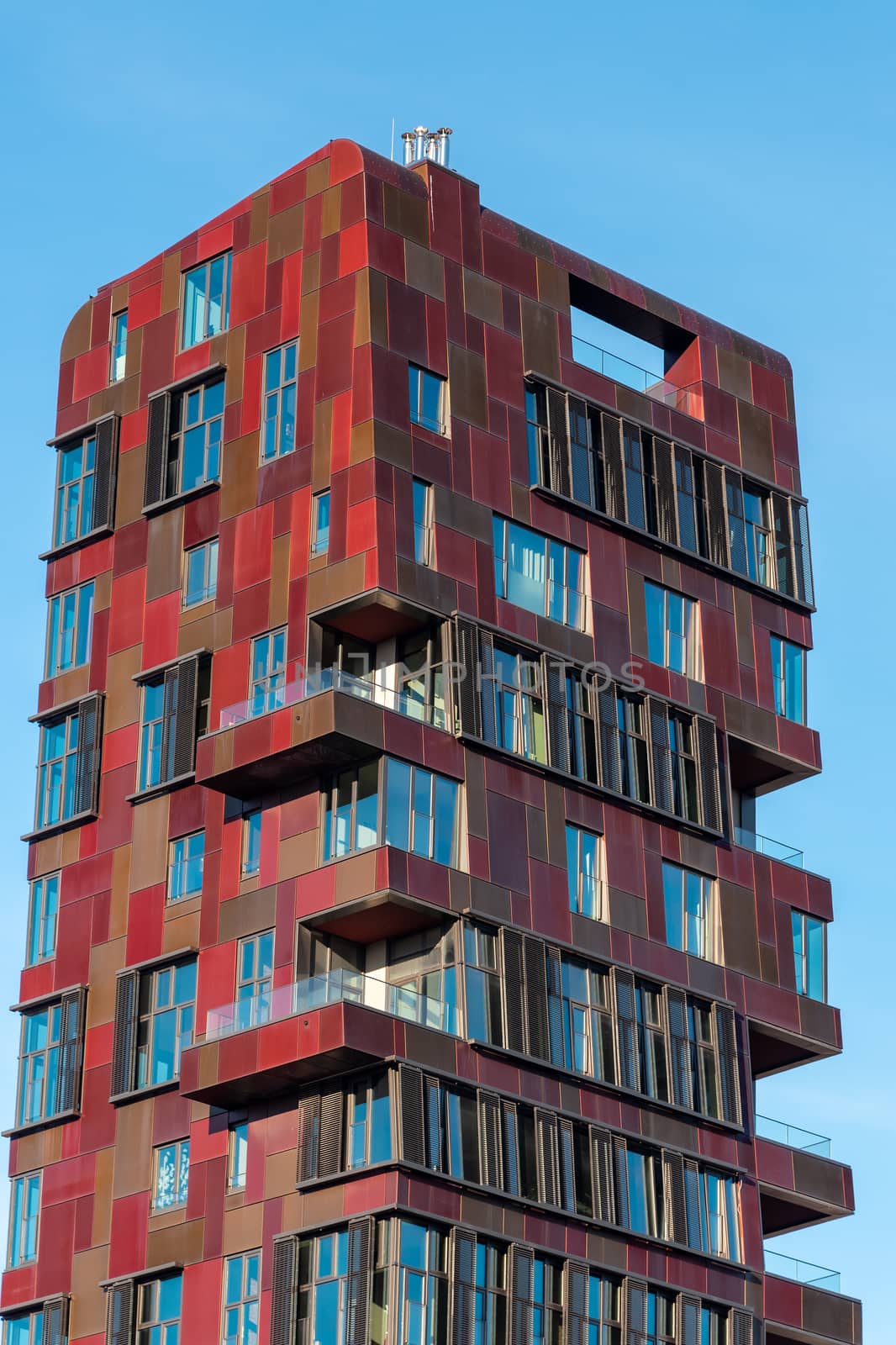 Modern red highrise apartment building seen in the Hafencity in Hamburg, Germany