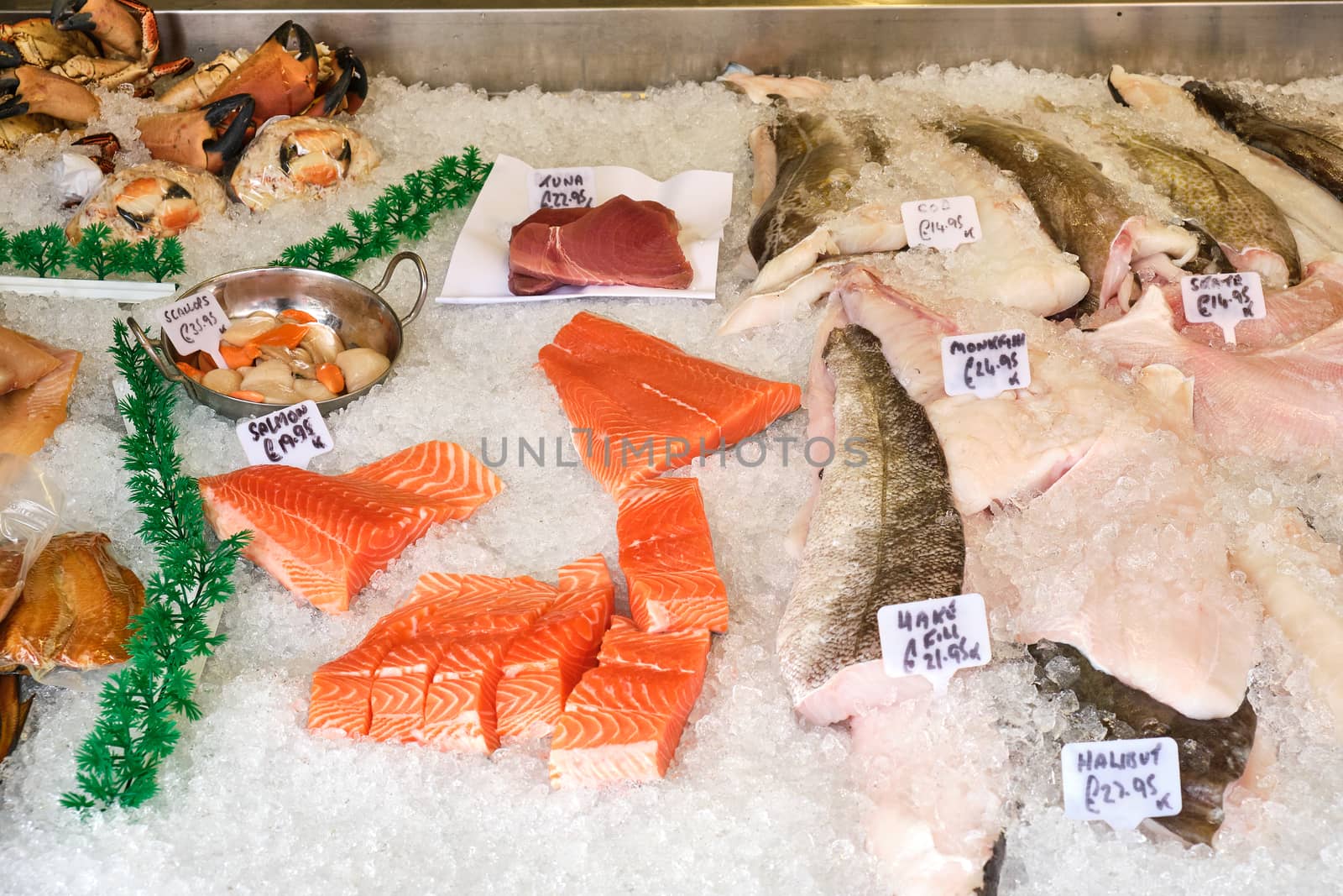 Fresh salmon fillet and other fish and seafood for sale at a market