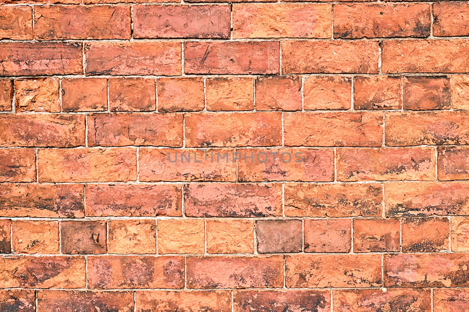 Background from an old and rugged orange brick wall