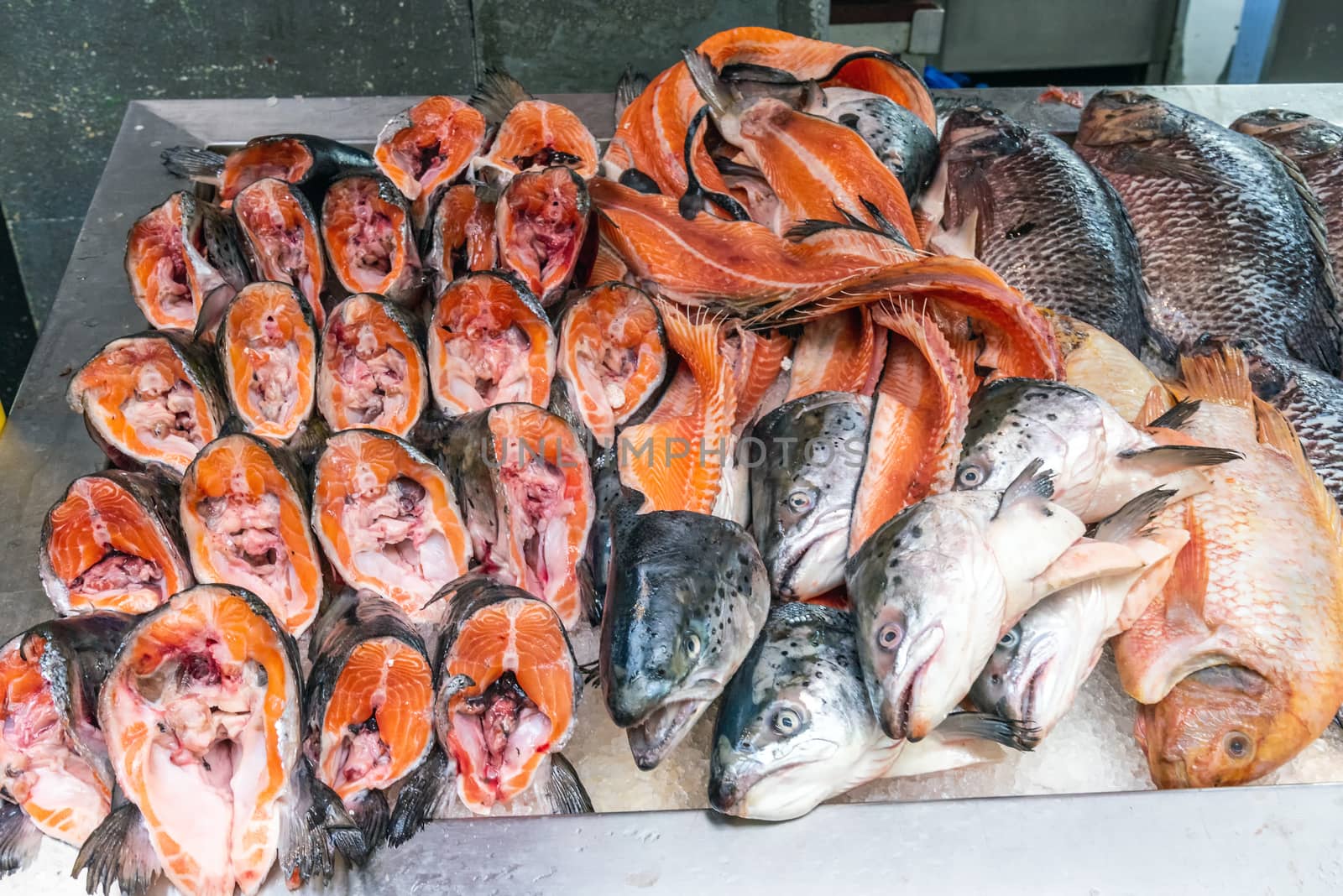 Parts of salmons for sale at a market