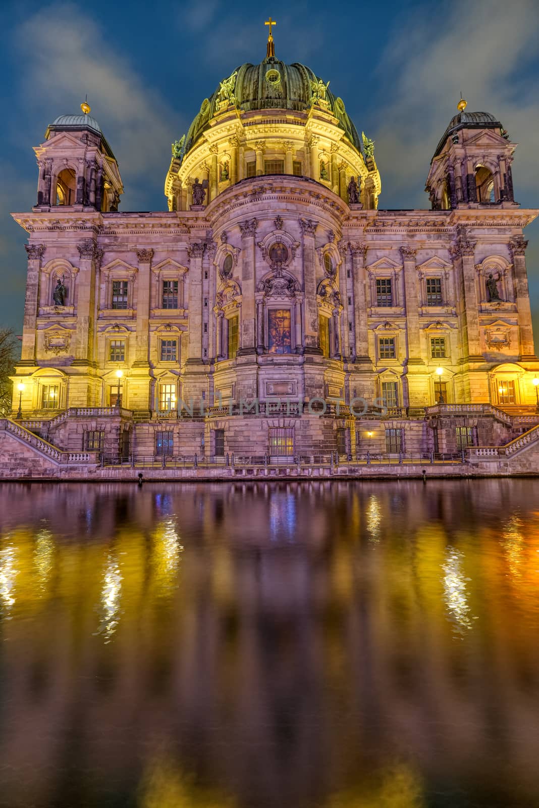 The backside of the Berlin Cathedral with the river Spree at dusk