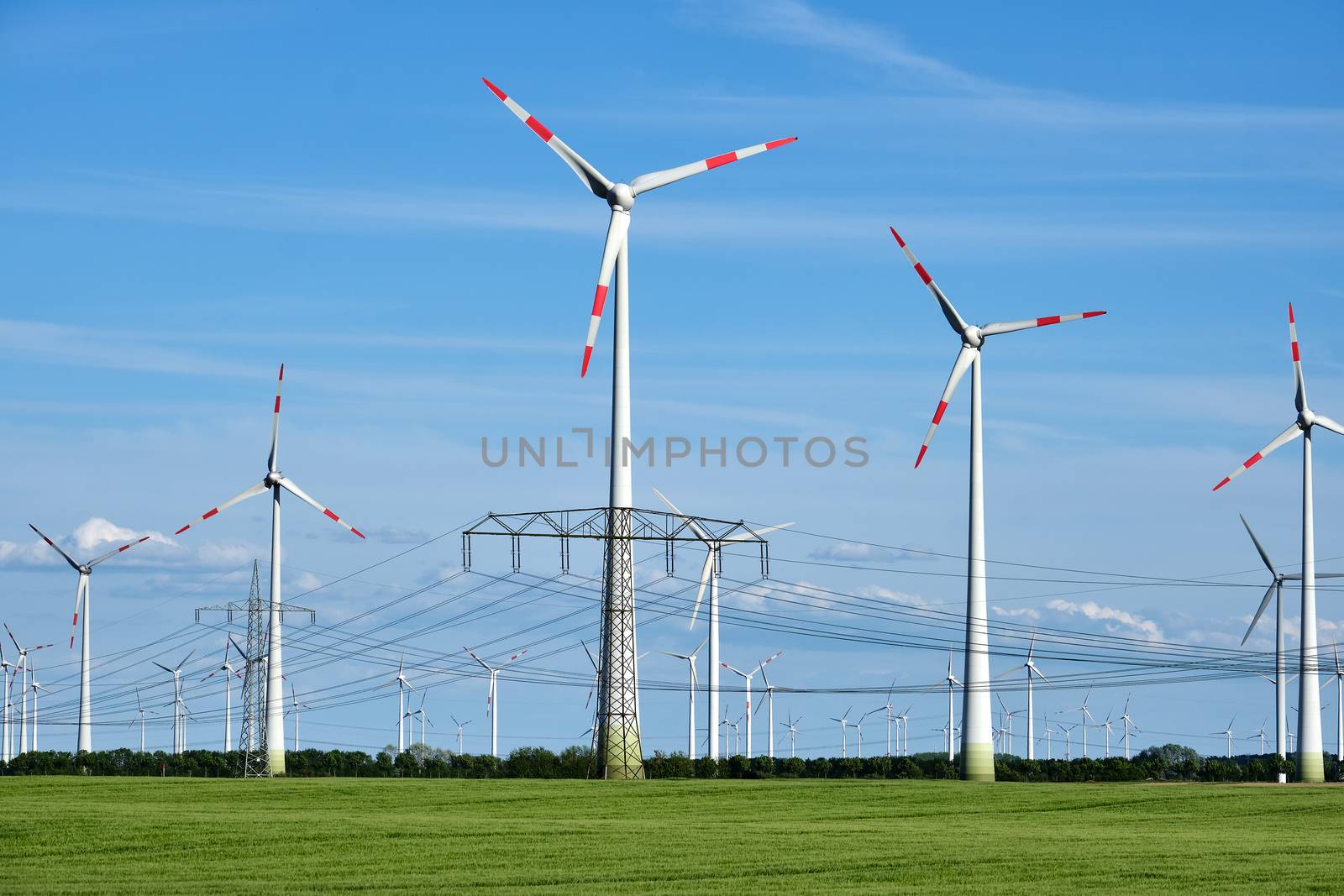 Overhead power lines and wind engines seen in Germany