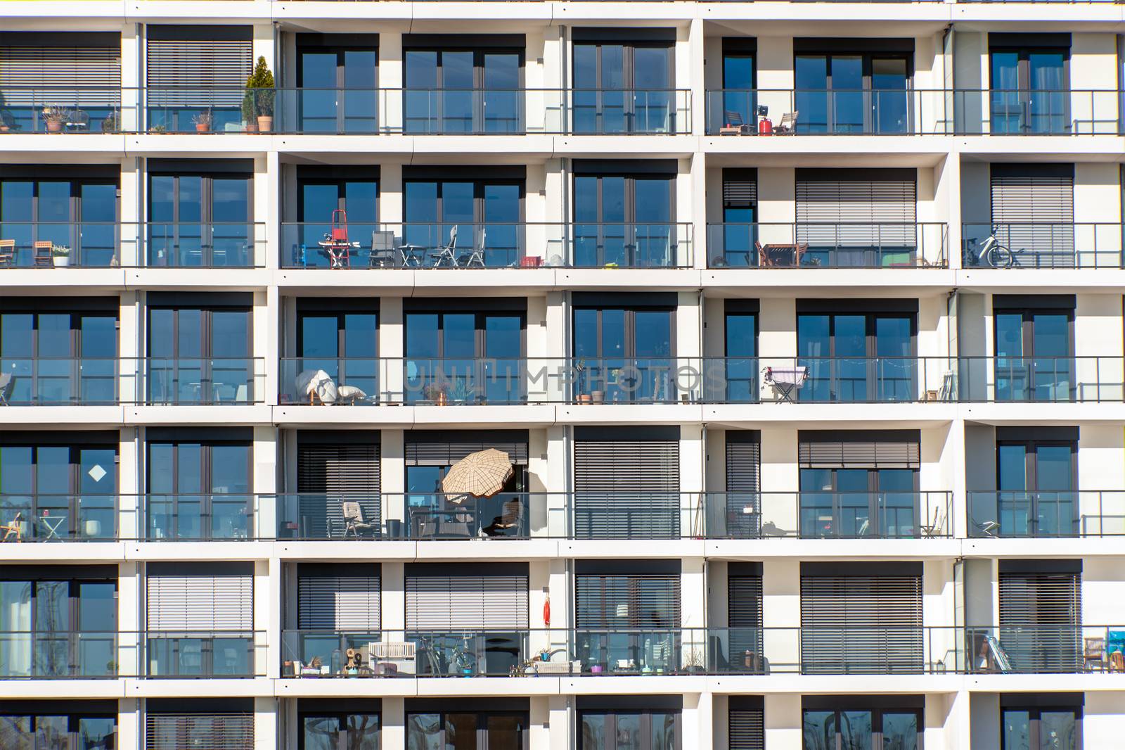 Glass facade of a modern apartment building with a lot of balconies seen in Hamburg, Germany