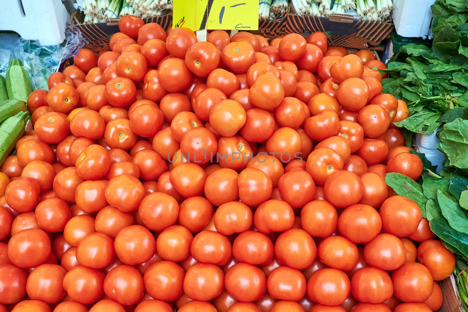 Pile of ripe red tomatoes for sale at a market