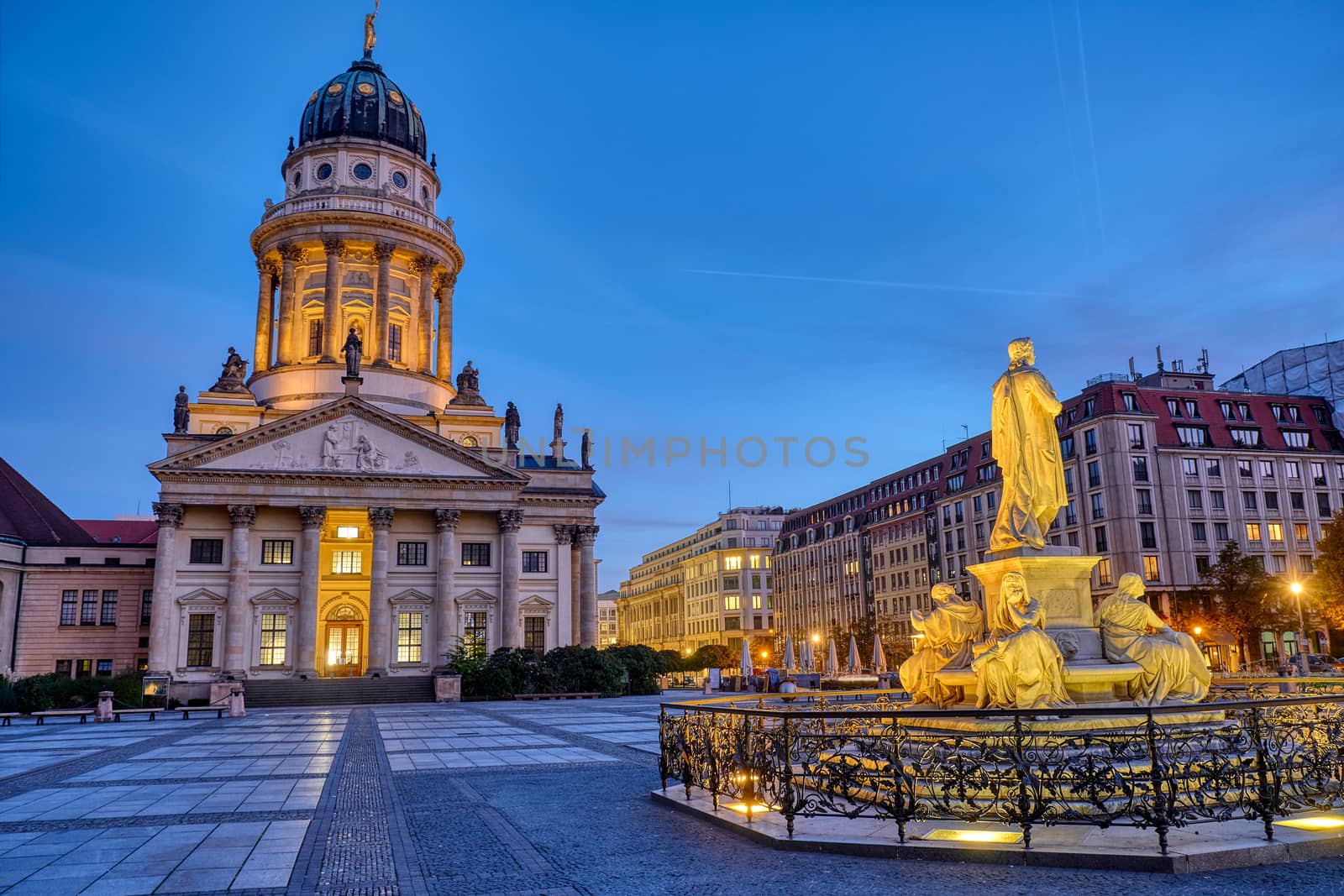 The French Cathedral and the Schiller Monument at the Gendarmenmarkt in Berlin at dawn