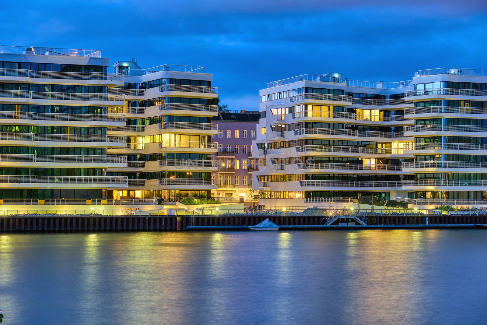 Modern apartment buildings at the river Spree in Berlin at night