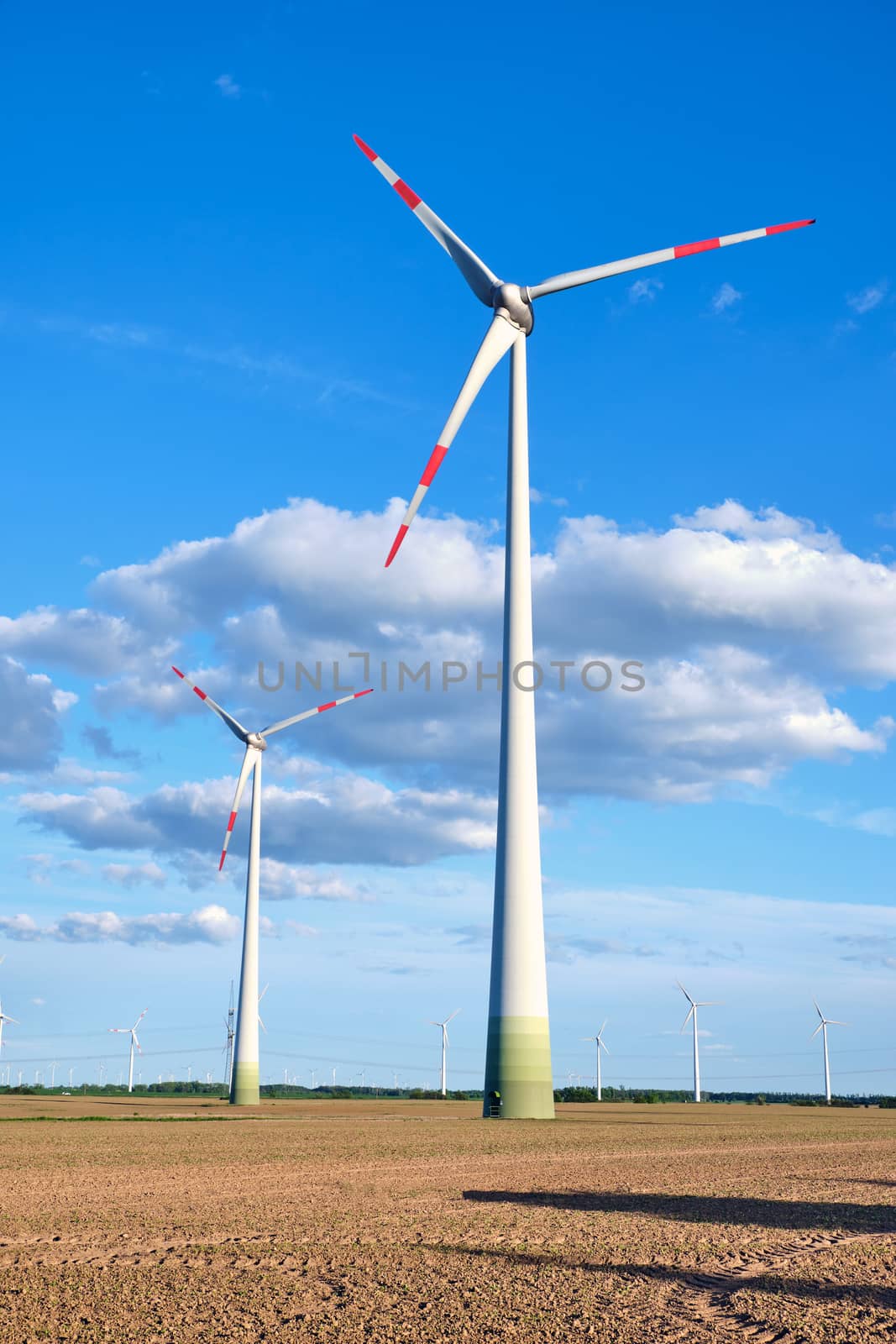 Wind wheels in a barren field seen in Germany