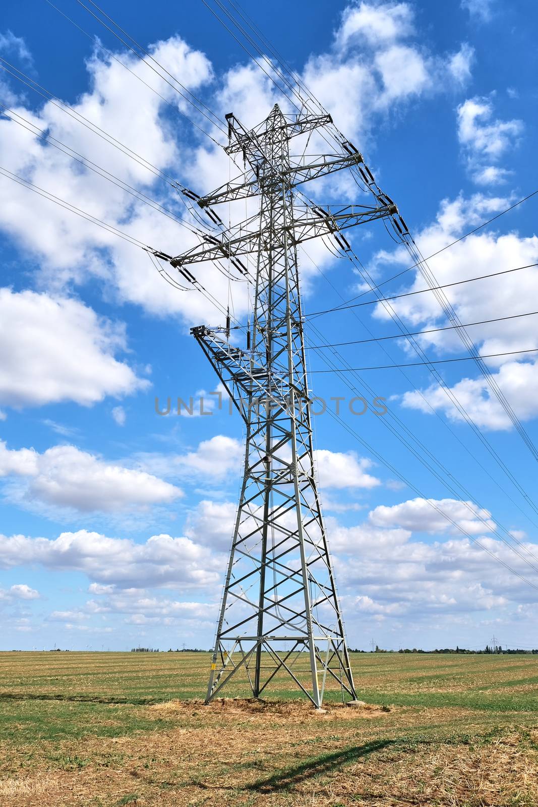 An electricity pylon with medium voltage power lines by elxeneize