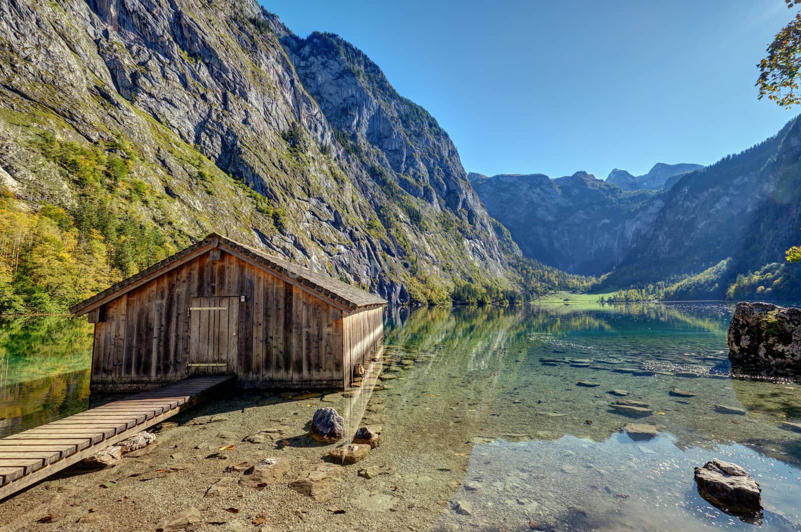 The Obersee in the Bavarian Alps with a wooden boathouse