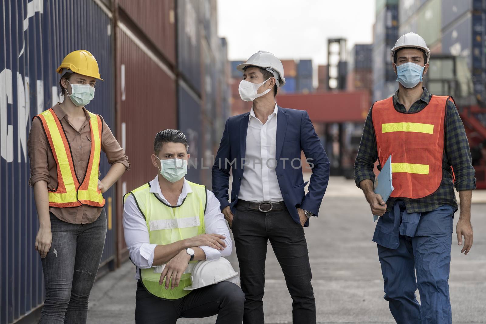 group people worker is wearing protection mask face and safety h by Ultramansk