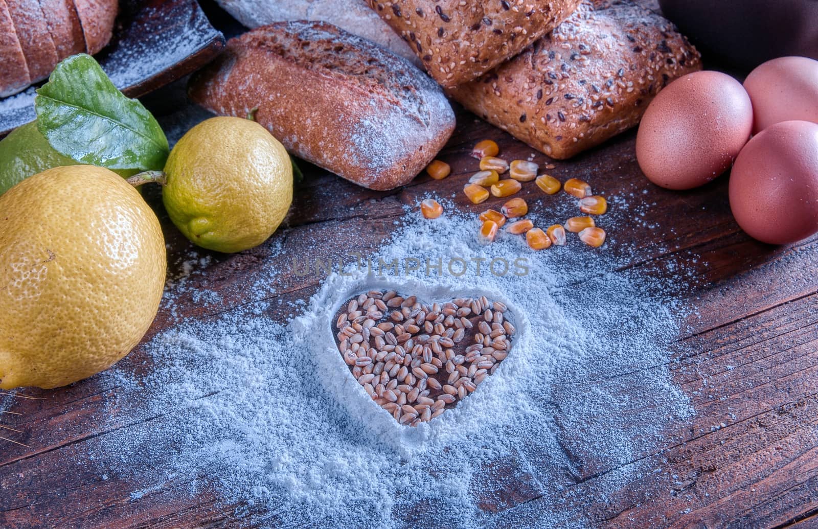 Bread and flour on a rustic wooden table. Bakery and grocery food store concept.