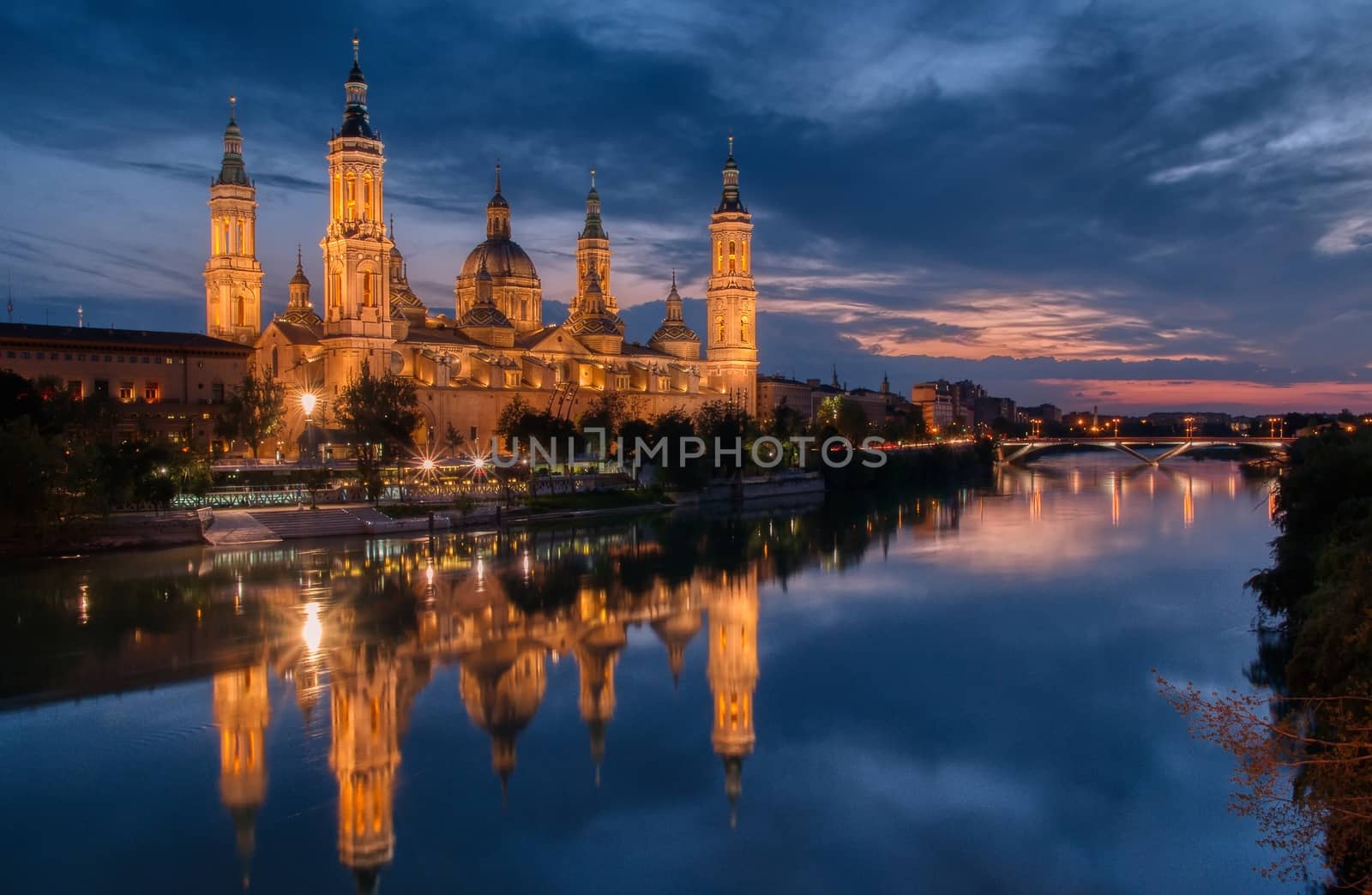 Basilica of our Lady of the Pillar and Ebro river in the evening, Zaragoza, Aragon, Spain.