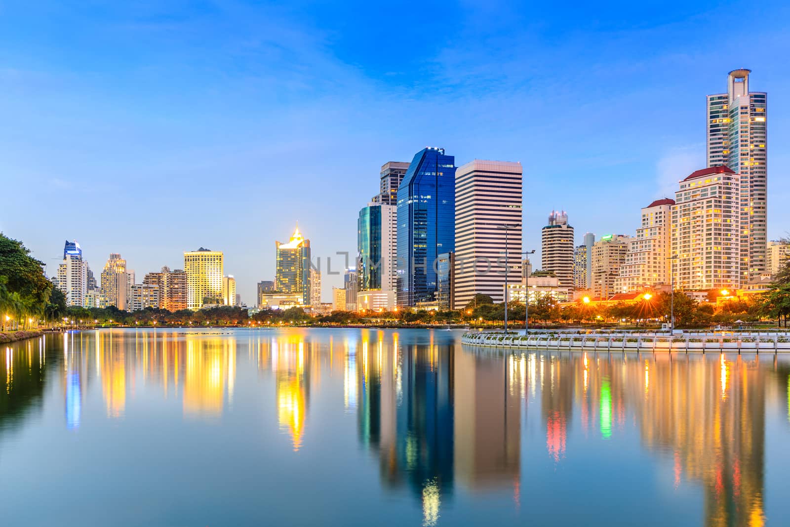 Modern buildings in office district at twilight in Bangkok , Thailand, with blue sky.