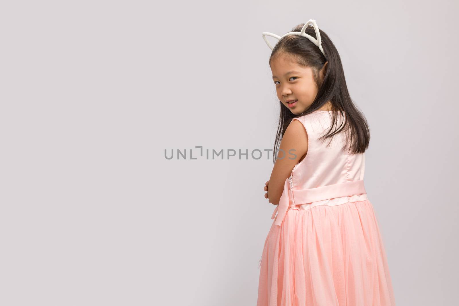 Kid with cat ear headband, isolated on white background.