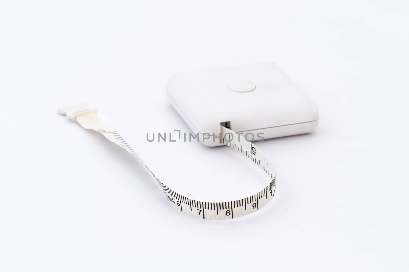 Studio shot of measuring tape isolated on white background.