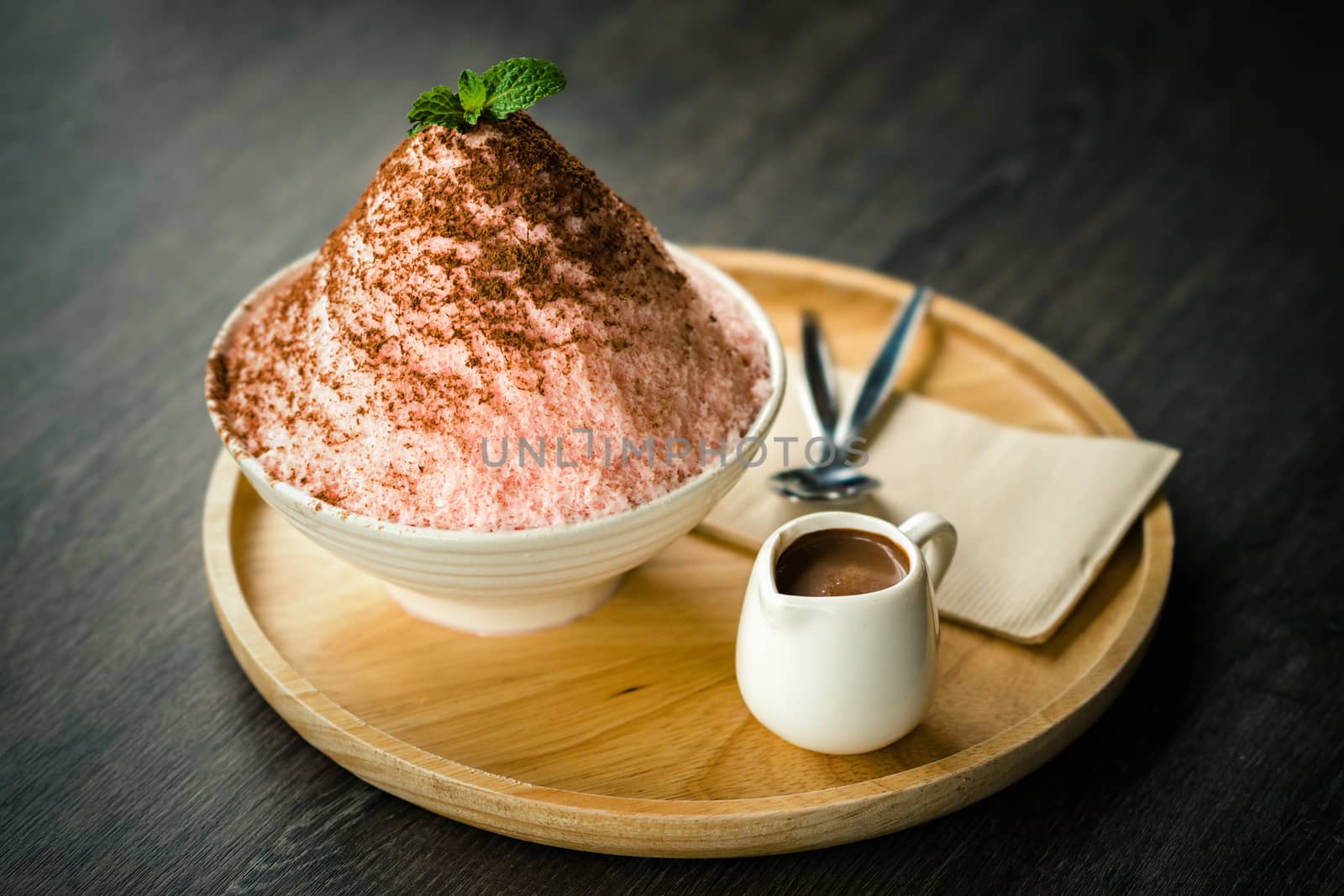 Bingsu or Korean shave ice with chocolate sauce on top.