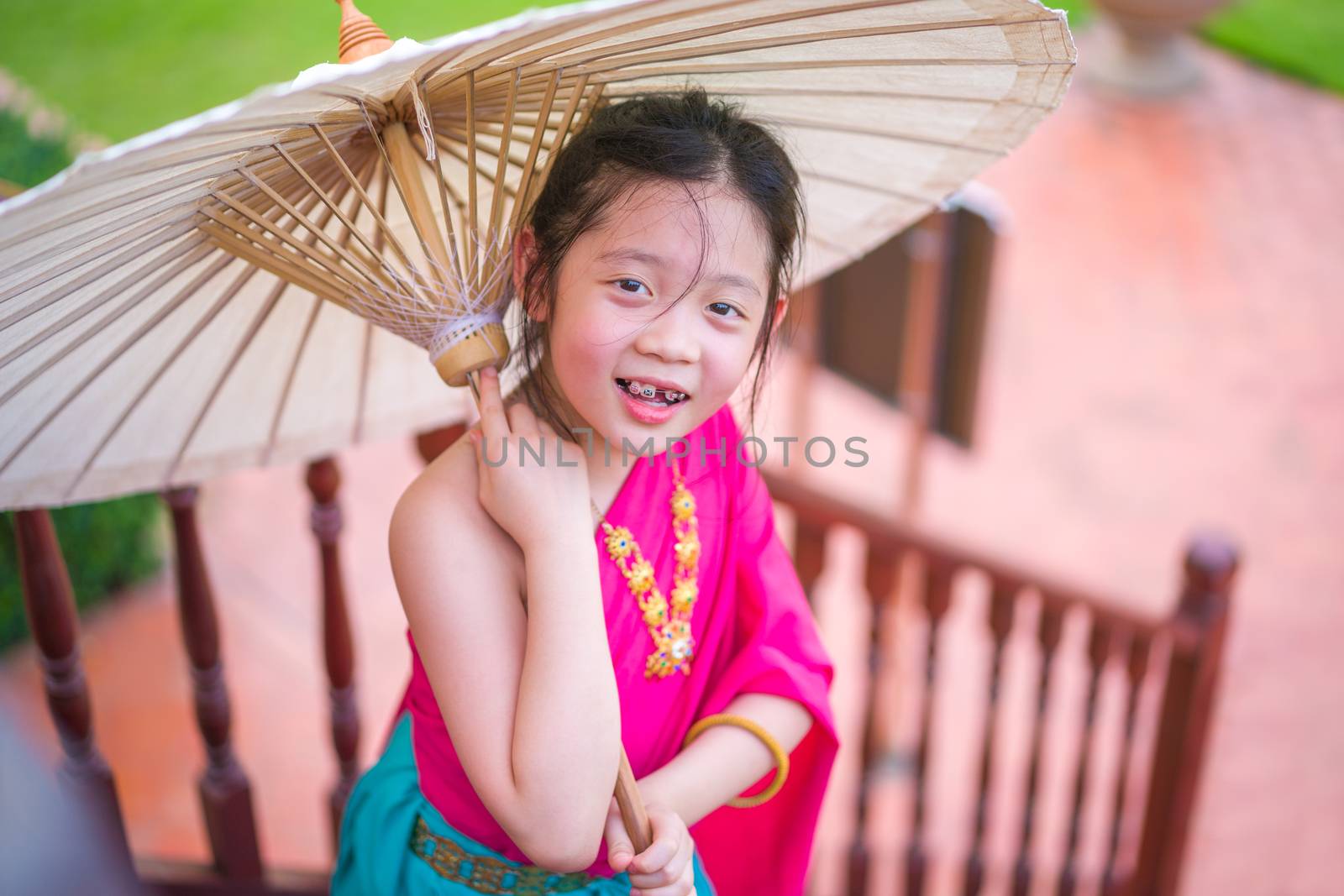 Child, Thai girl, in Thai national costume.