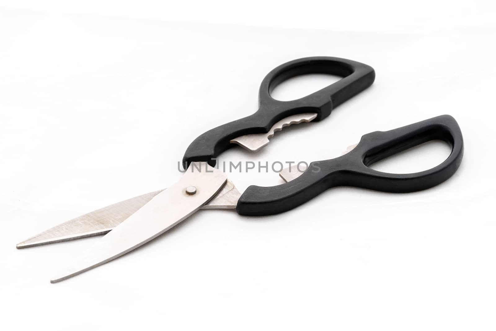 Isolated kitchen scissors for food on white background.