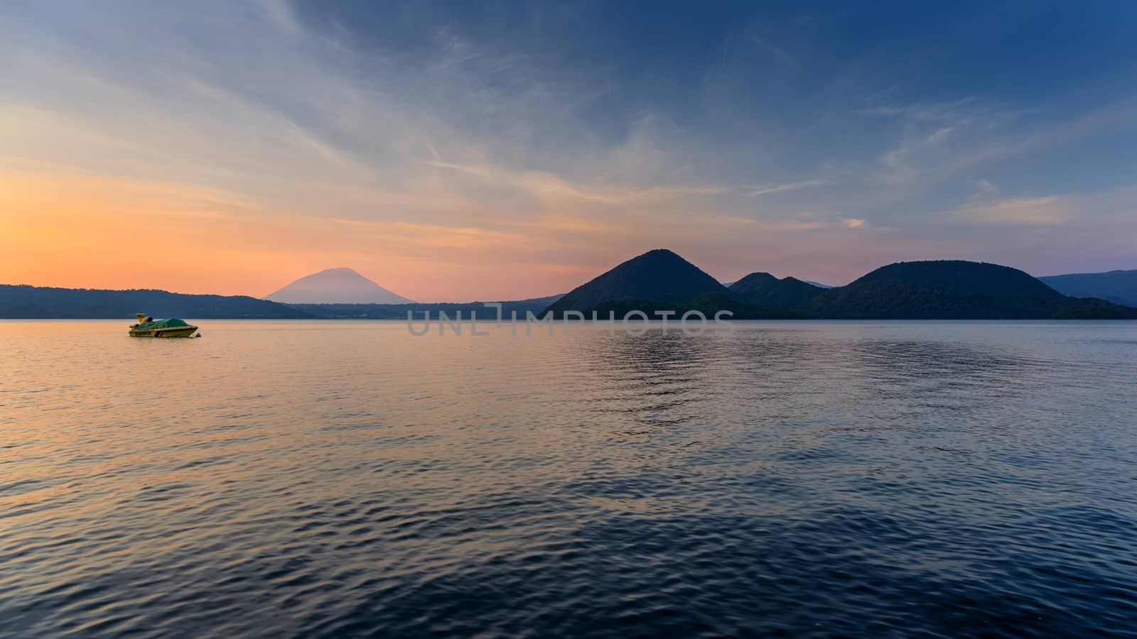 Scene of mountain and lake at twilight in Hokkaido, Japan.