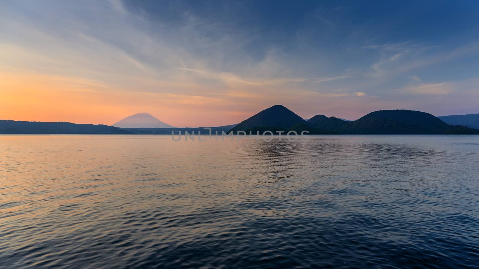 Scene of mountain and lake at twilight in Hokkaido, Japan.