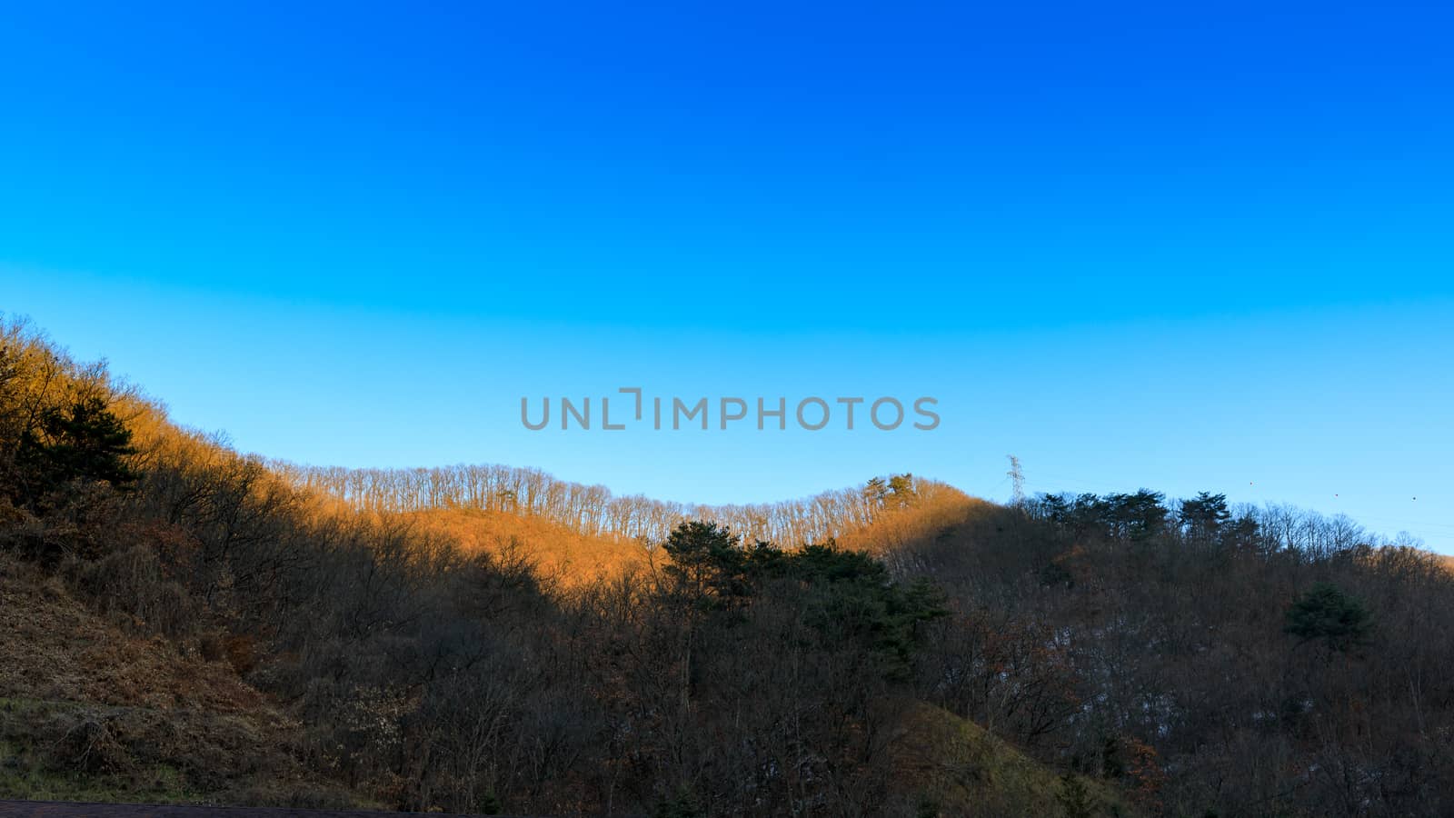 Background of clear blue sky and mountain in evening.