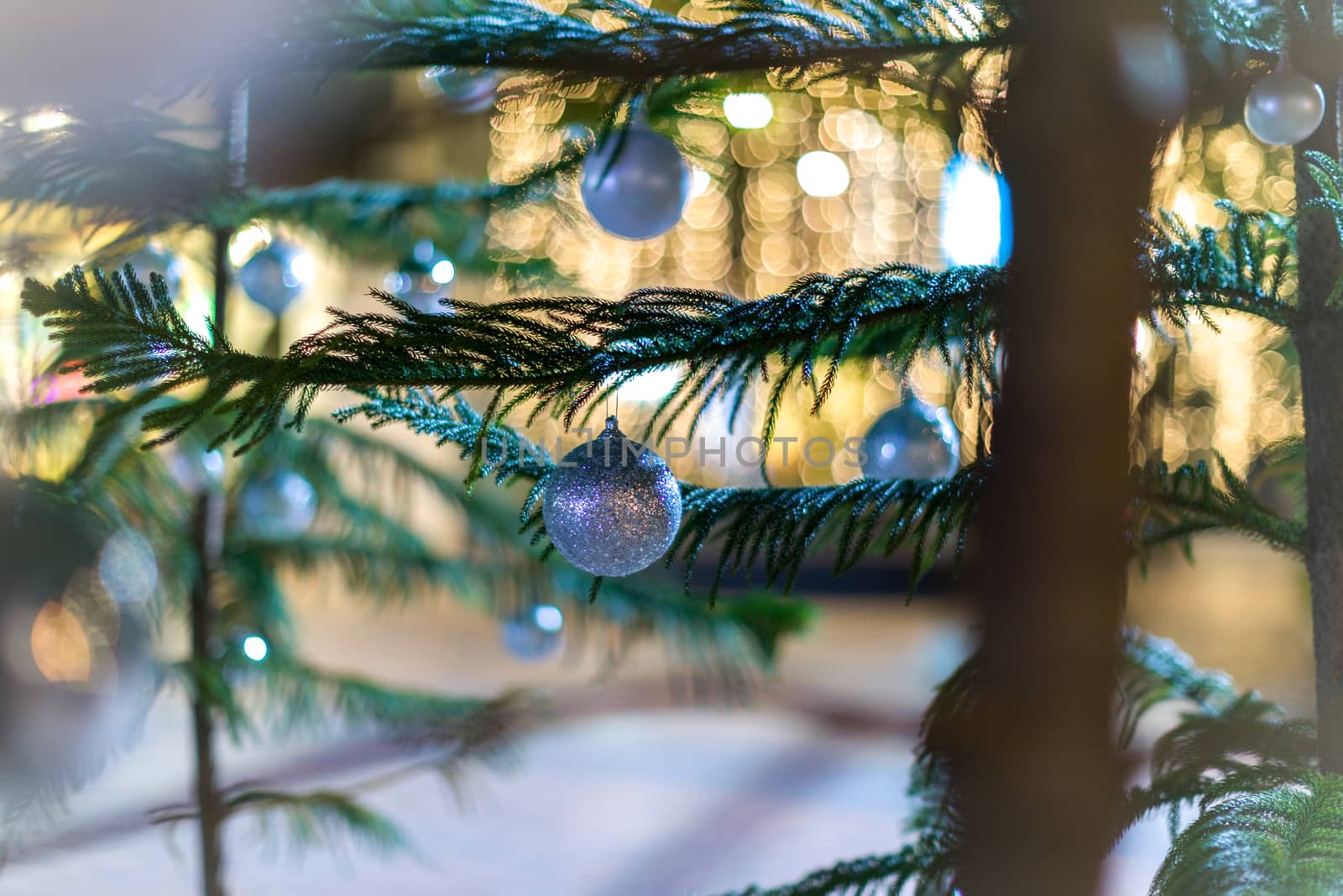 Background of Christmas tree with snow and bokeh.