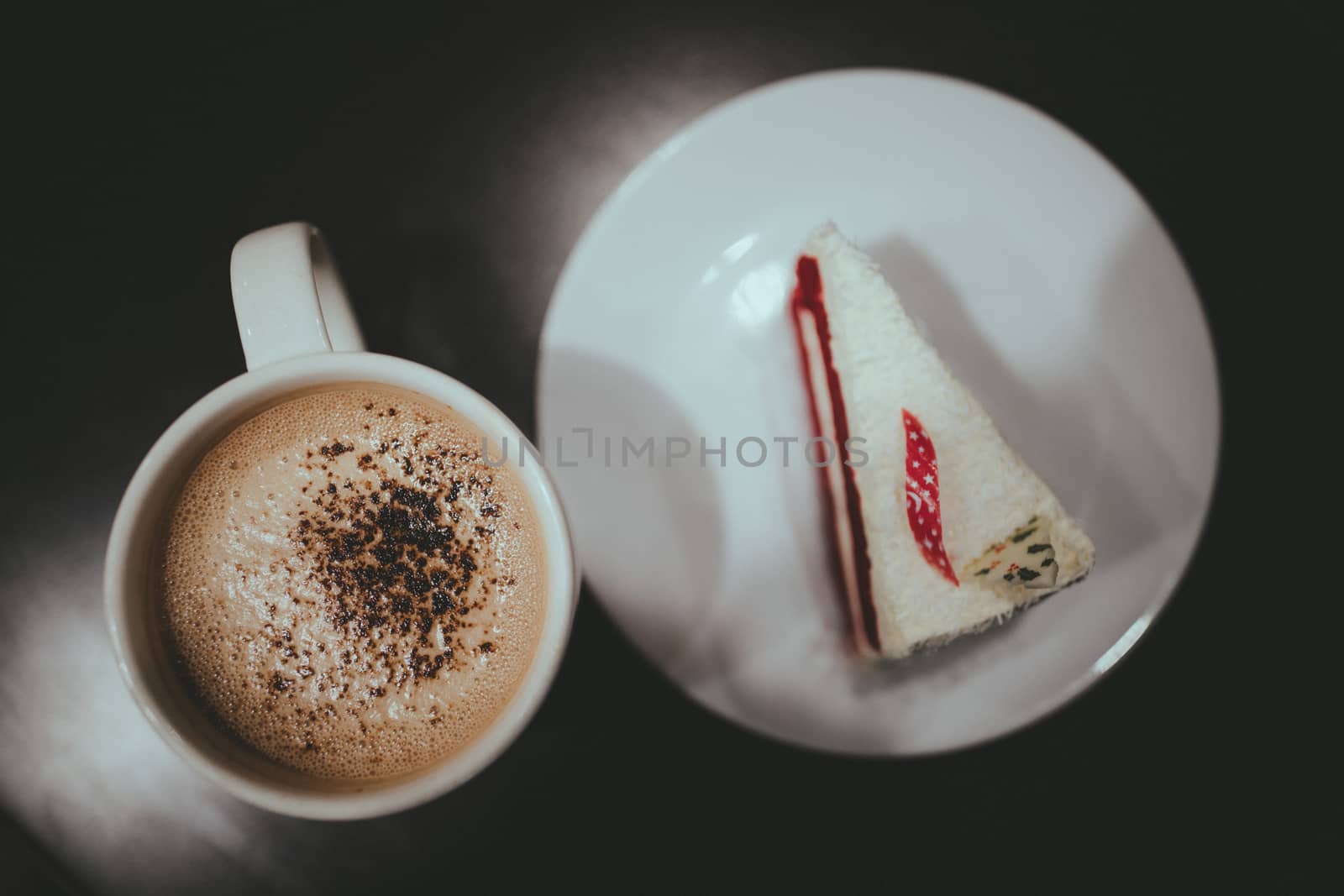 Vintage film look of coffee and cake.