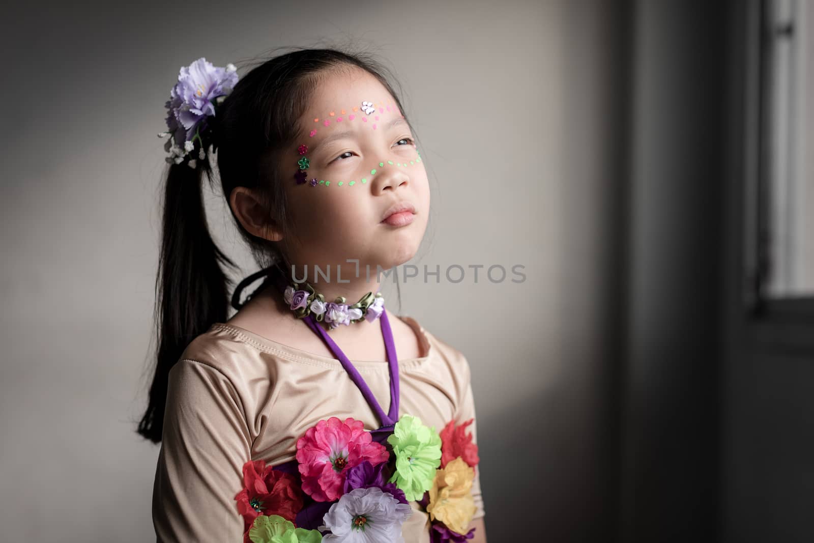Sad face expression of Asian only child.