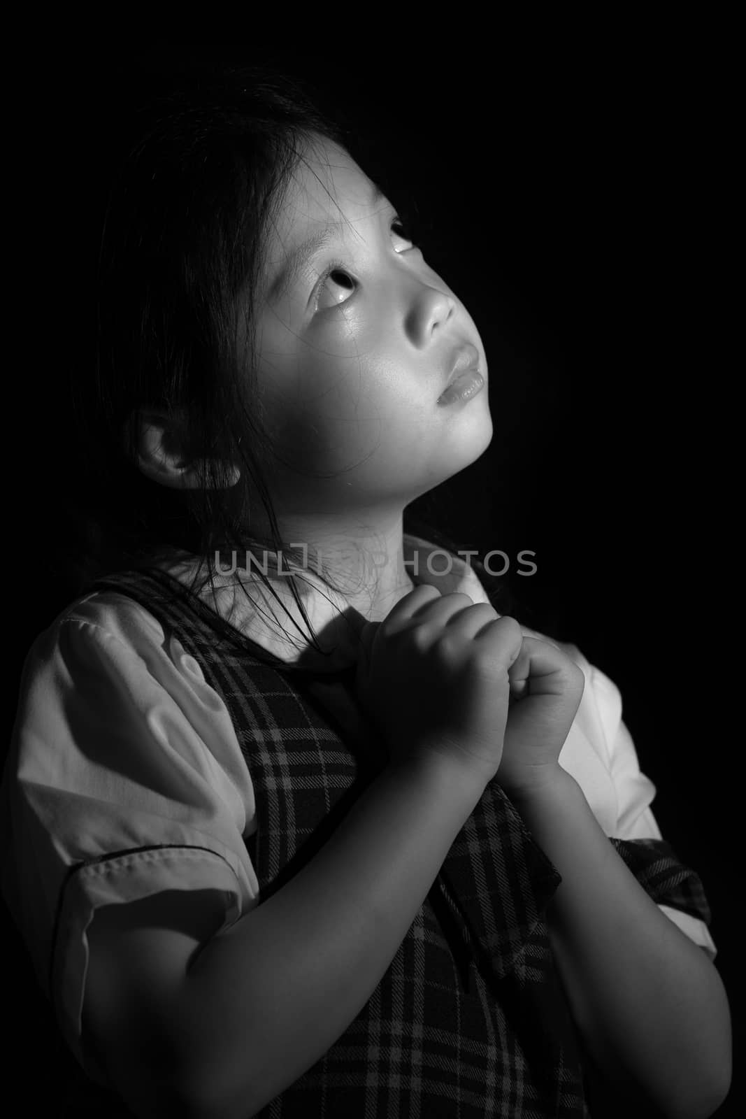 Black and white portrait of sad and lonely Asian kid.