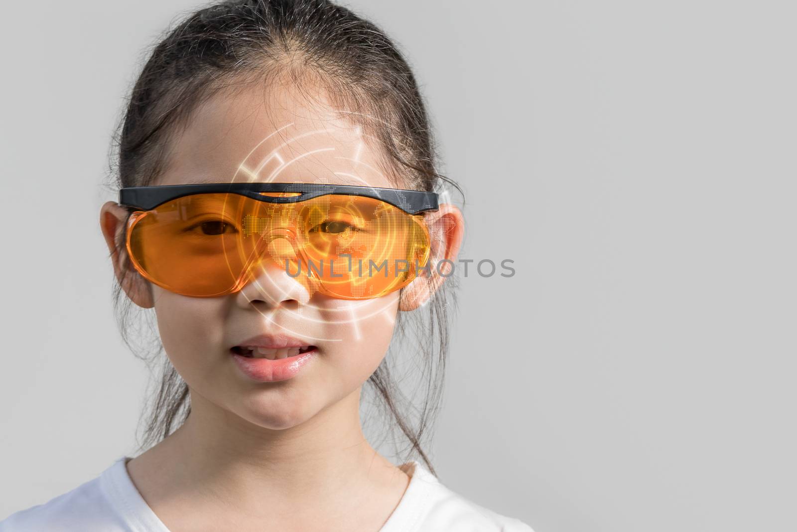 Concept of augmented reality illustrated by child wearing futuristic smart glasses device displaying digital information.