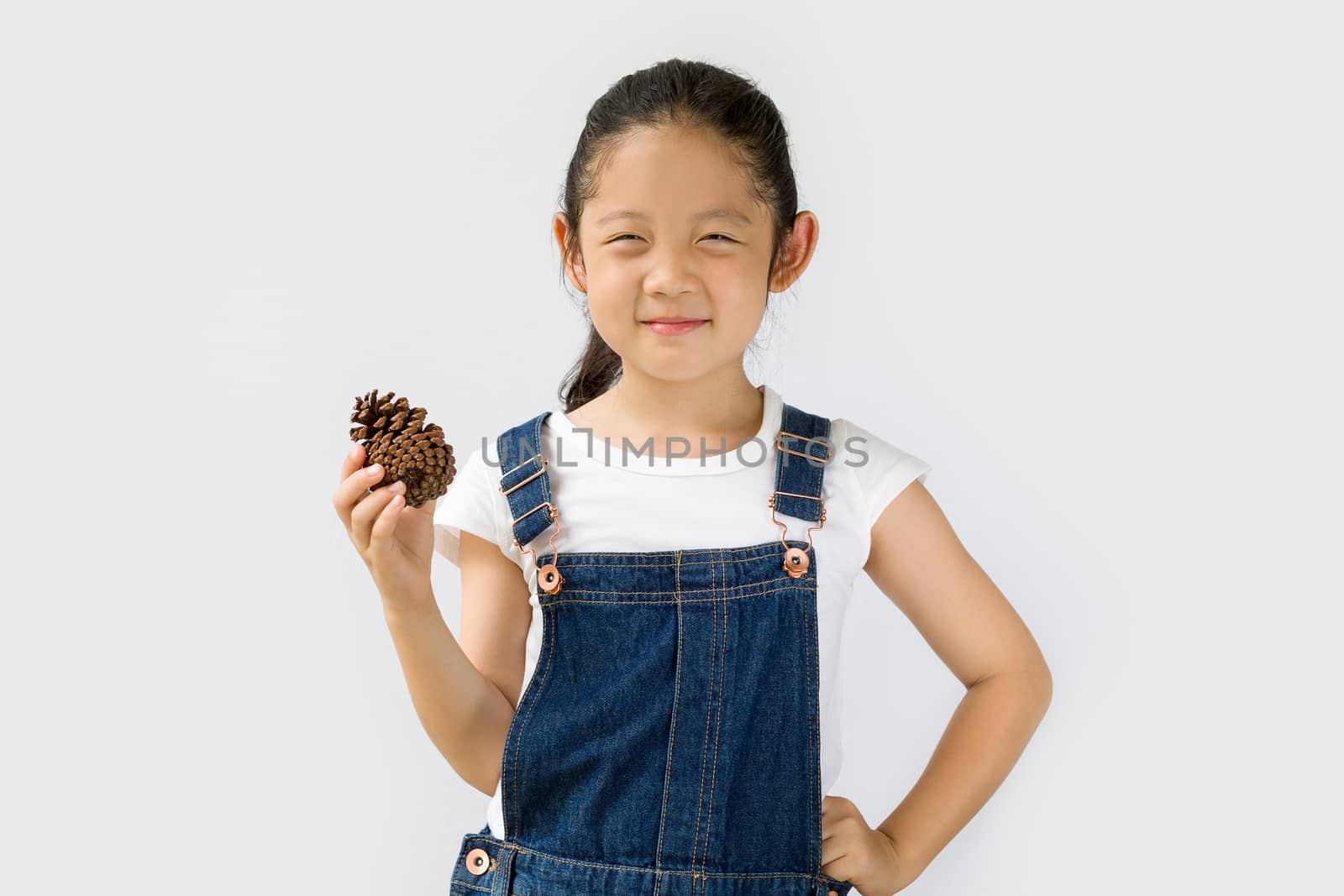 Studio shot of organic farming concept, Asian child farmer, isolated on white background.