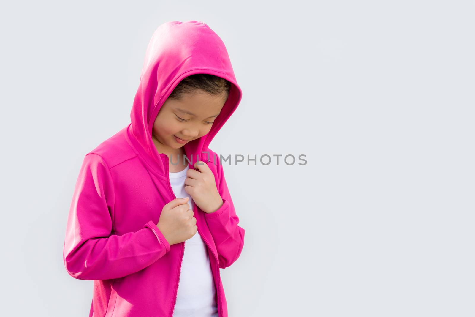 Studio Shot of Asian child in sweater isolated on white background.
