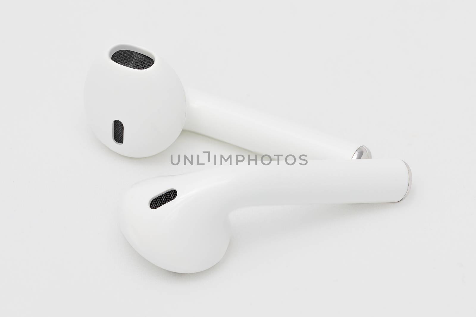 Studio shot of wireless Bluetooth earphone or earbud  or headphone, isolated on white background.